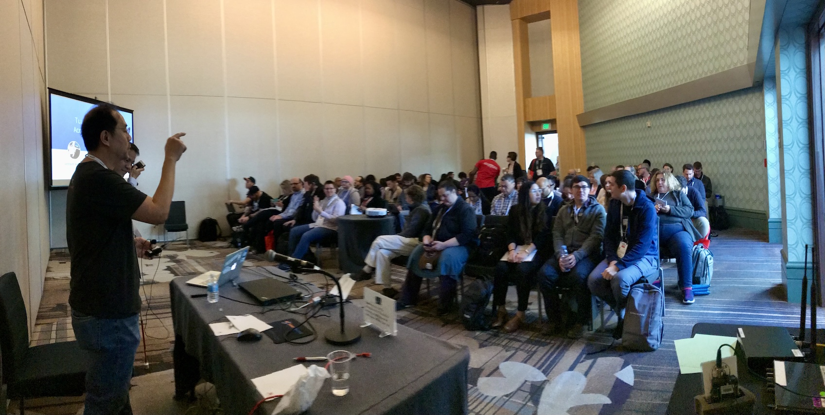 Team members preparing before giving accessibility presentation